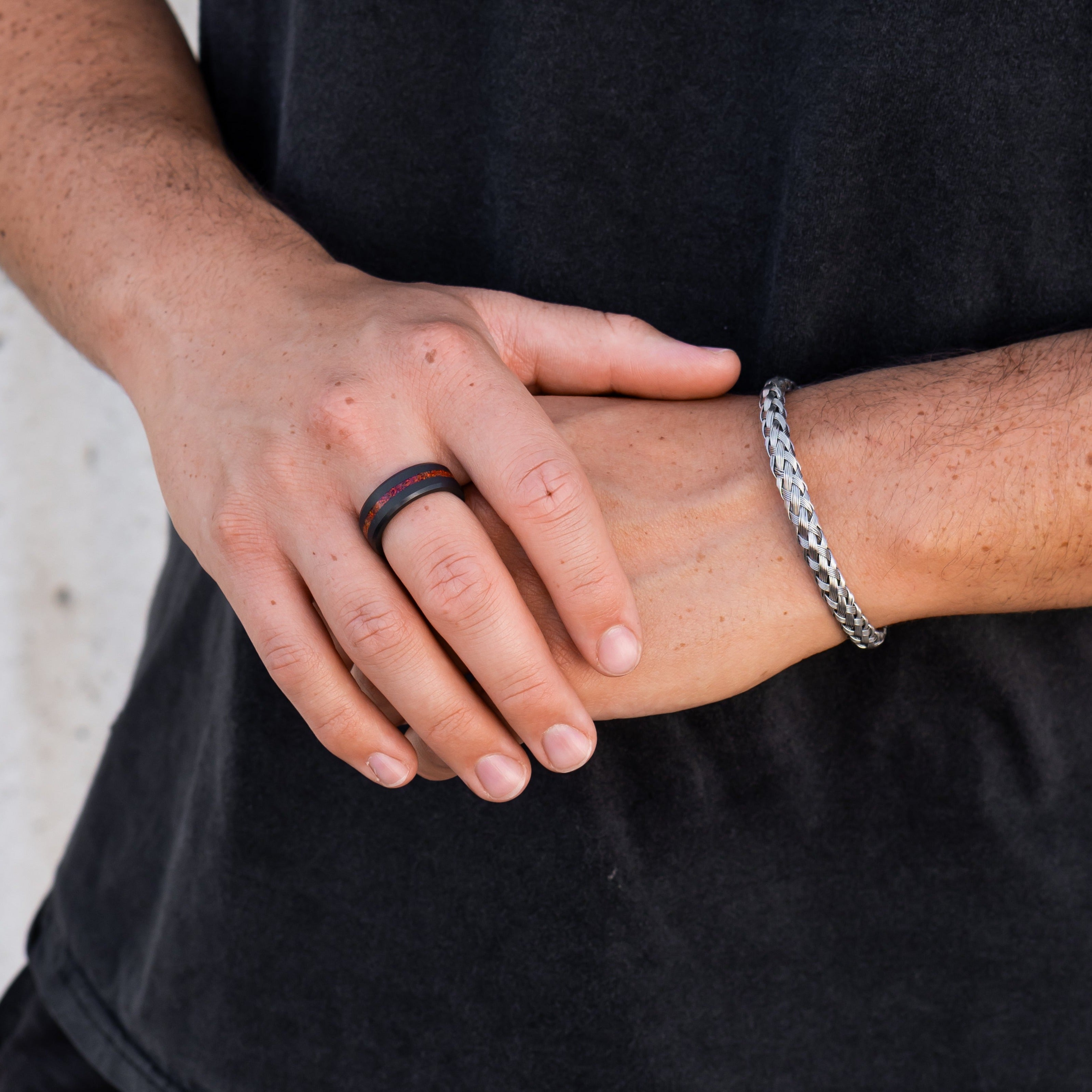 Lifestyle shot #3 of men's hands wearing our Elysium ARES Men's Black Diamond & Red Opal ring | ElysiumBlack.com | Men’s Opal Rings | Opal Rings for Men