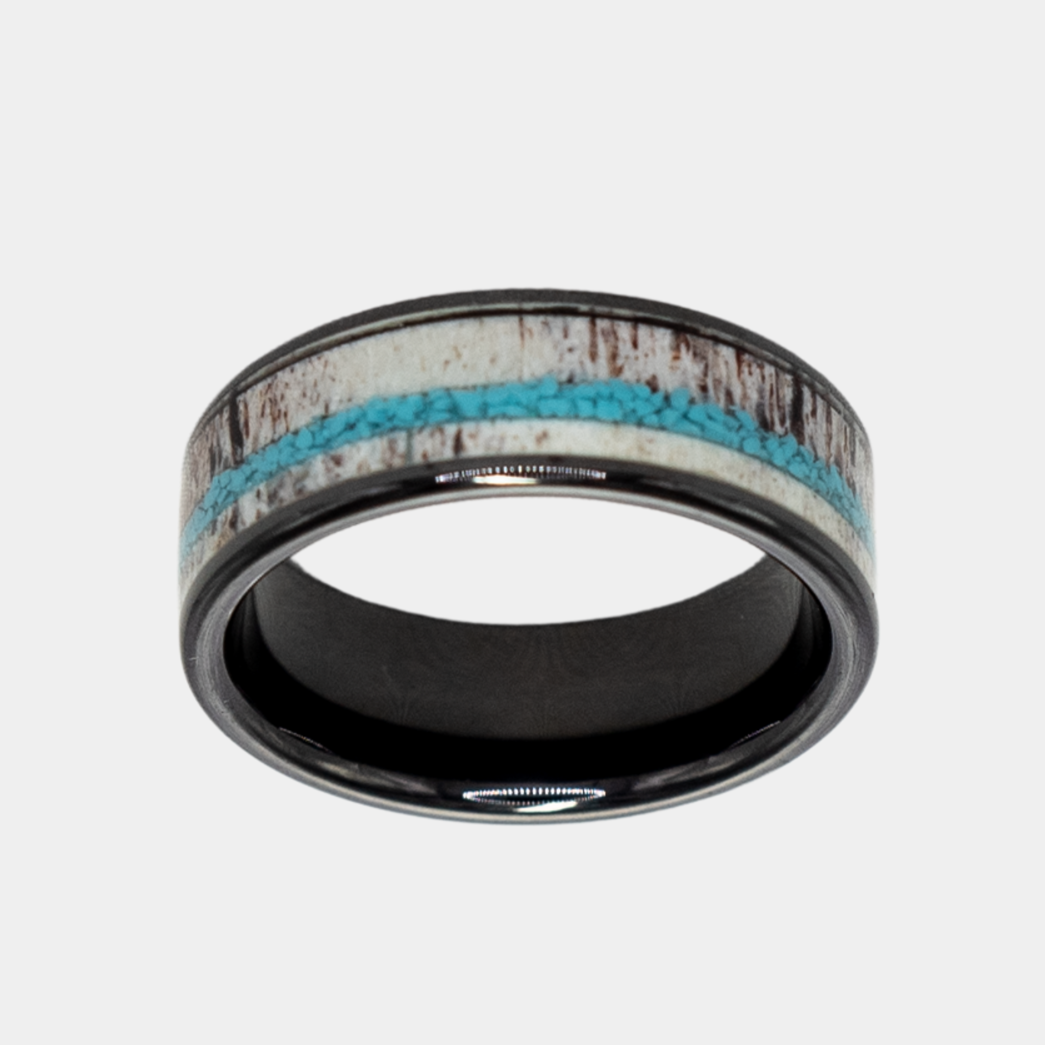 Hermes ring – solid black diamond with polished beveled edges from the Hustler Collection. Top-down view showcasing ring face.