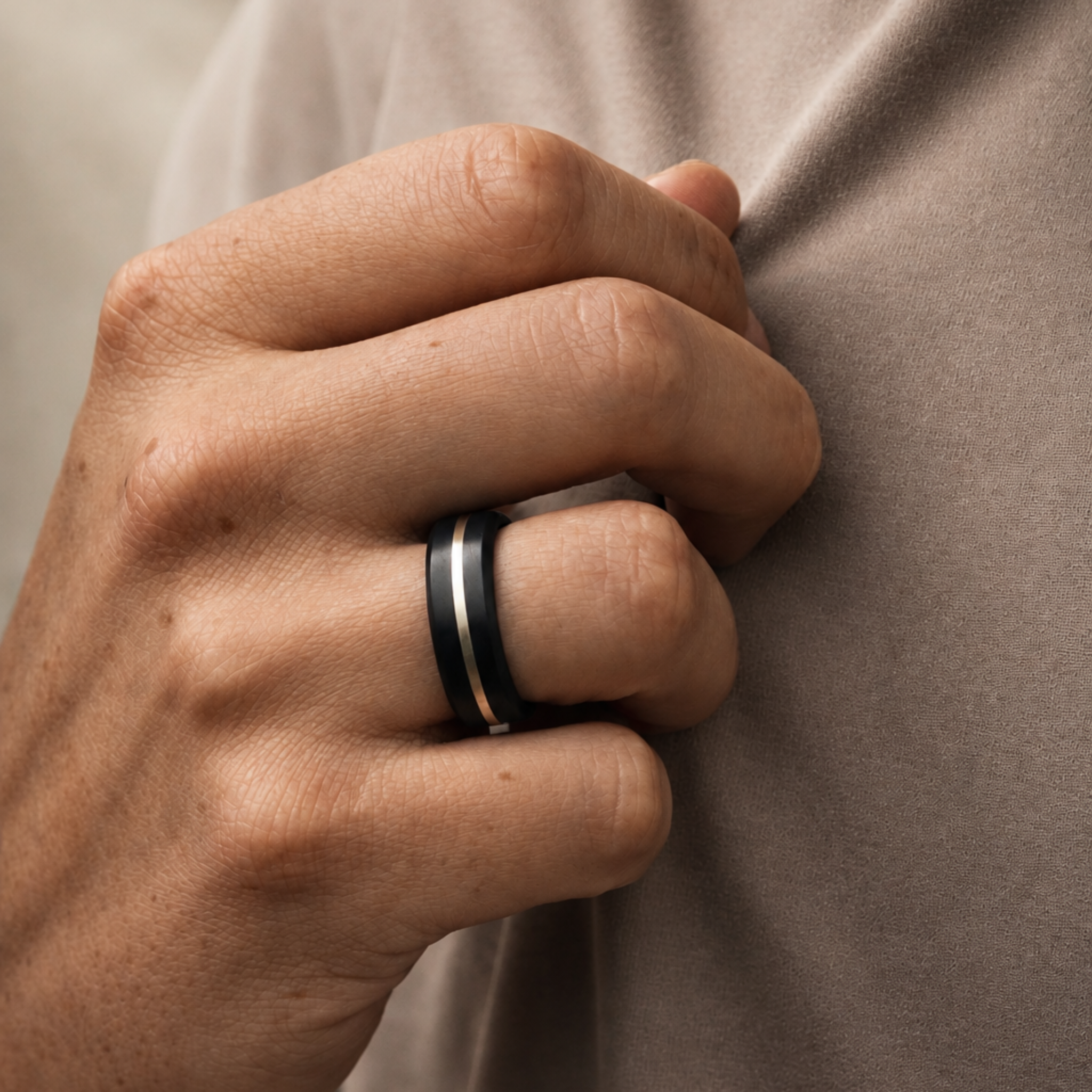 ARES 7mm silver inlay wedding band in solid black diamond worn on hand